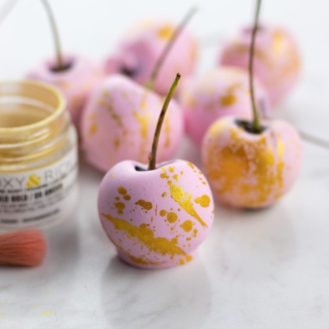 Pink covered pink cherries with gold lustre dust